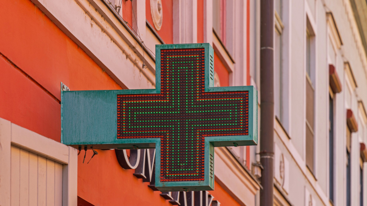 Red and Green Led Lights Cross Shape Sign at Pharmacy