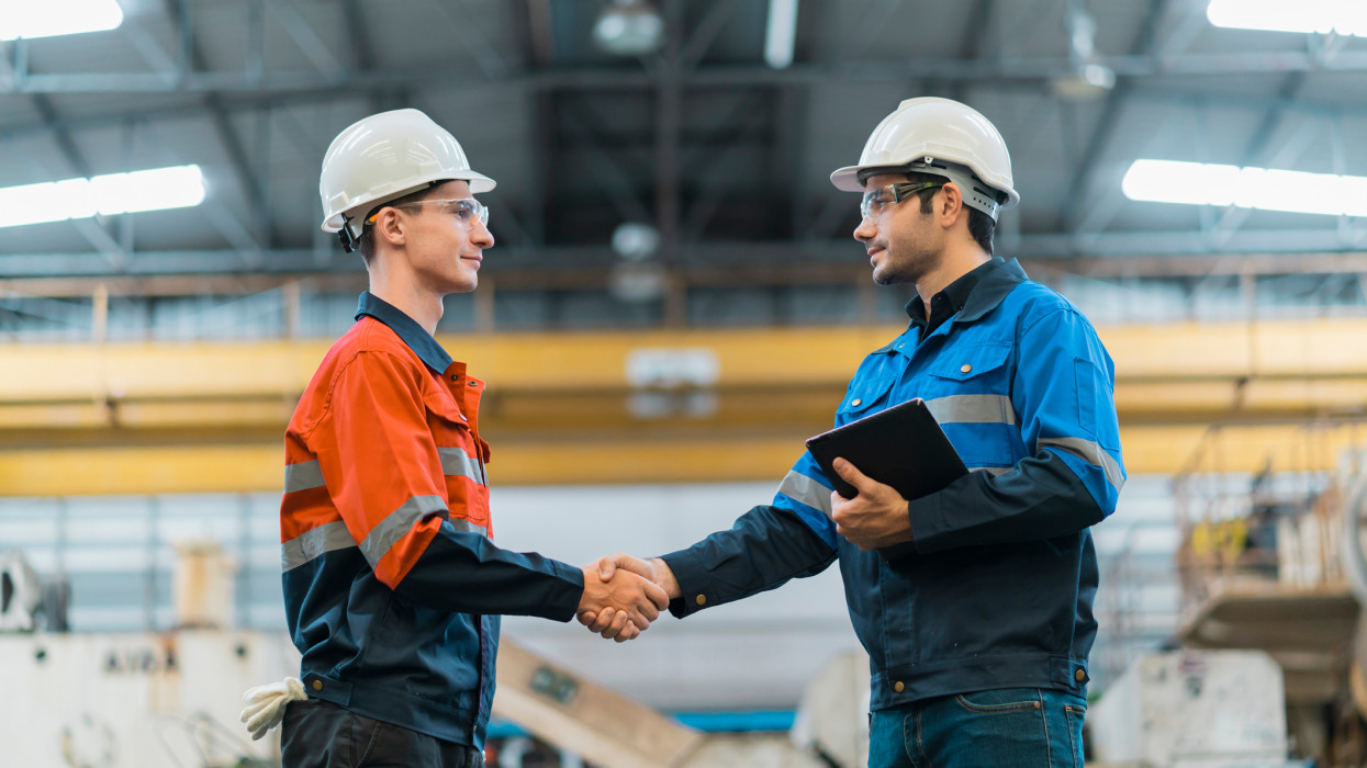 Hand shake greeting of professional  engineer teamwork in factory