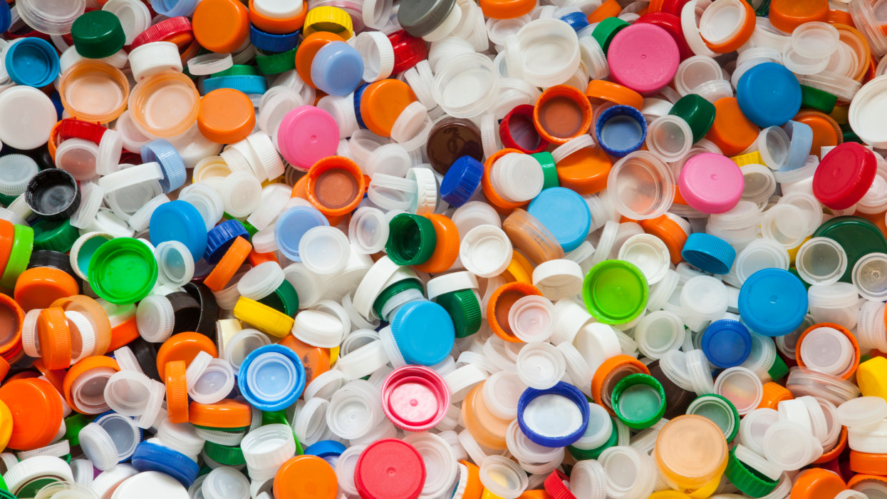 Hundreds of colorful twist off plastic bottle caps that can be used for upcycling or recycling.