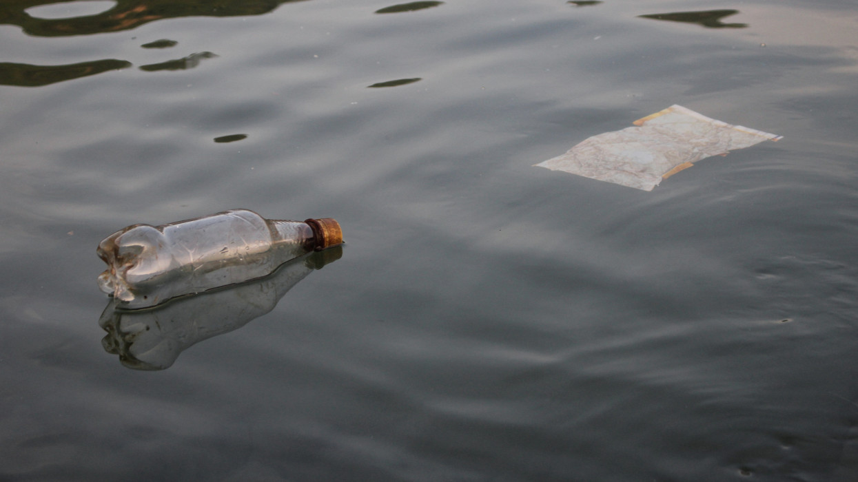plastic bottles floating and polluting the water