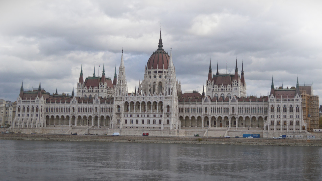 The Hungarian Parliament Building (Hungarian: OrszÃ¡ghÃ¡z, which translates to House of the Country or House of the Nation), also known as the Parliament of Budapest for being located in that city, is the seat of the National Assembly of Hungary, one of Europes oldest legislative buildings, a notable landmark of Hungary and a popular tourist destination of Budapest. It lies in Lajos Kossuth Square, on the bank of the Danube. It is currently the largest building in Hungary and still the tallest building in Budapest.