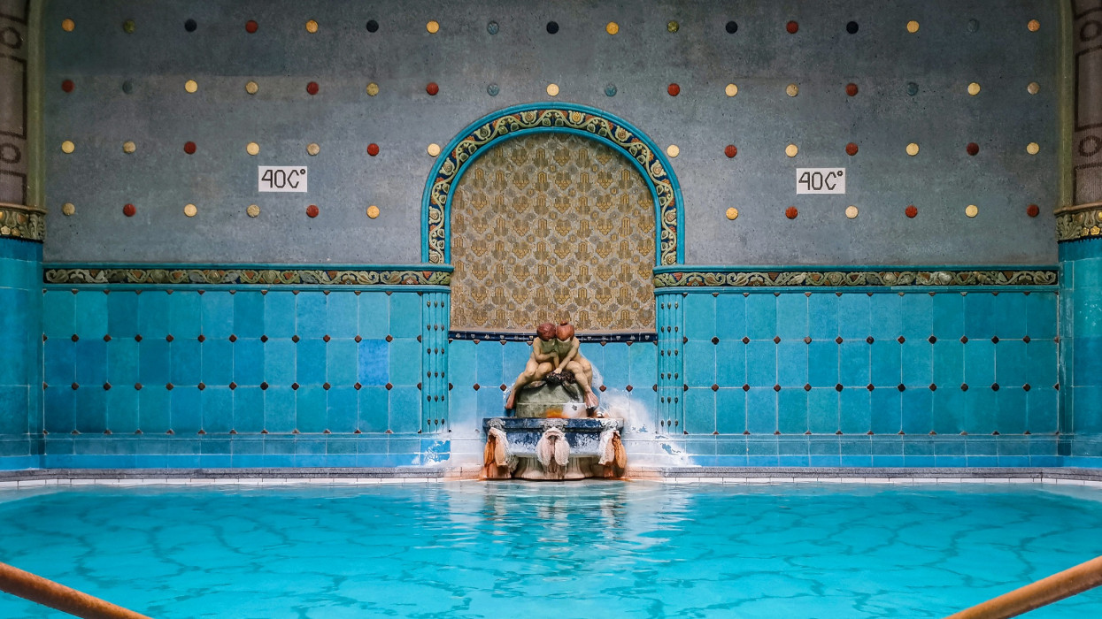 Spectacular design and architecture of Gellert Spa in Budapest, Hungary. Empty therapeutic thermal pool with beautiful blue and turquoise tiles.