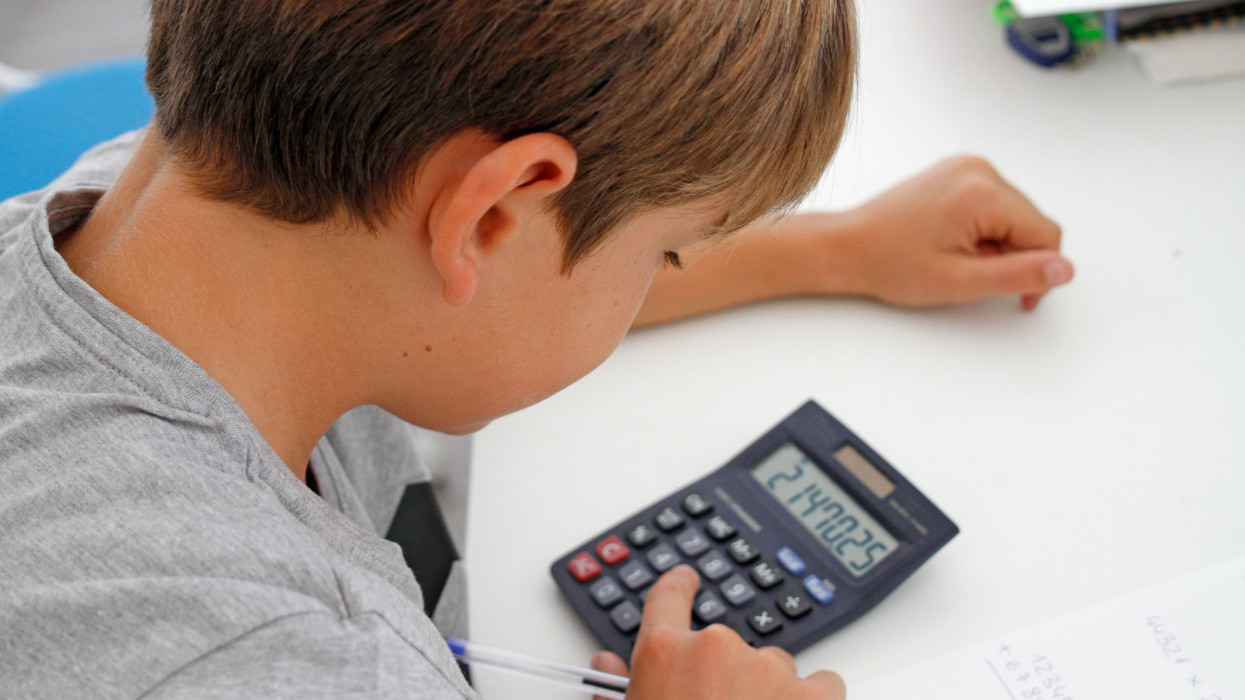 Student uses calculator to help with math homework