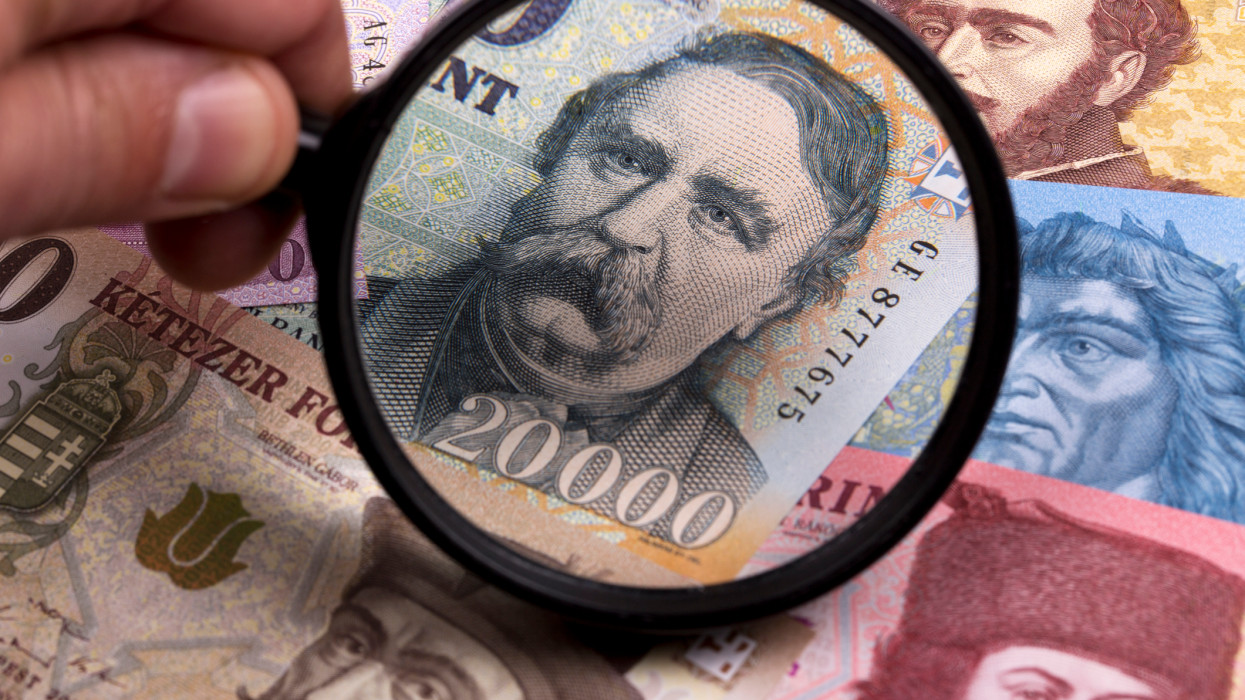 Hungarian forint in a magnifying glass a business background