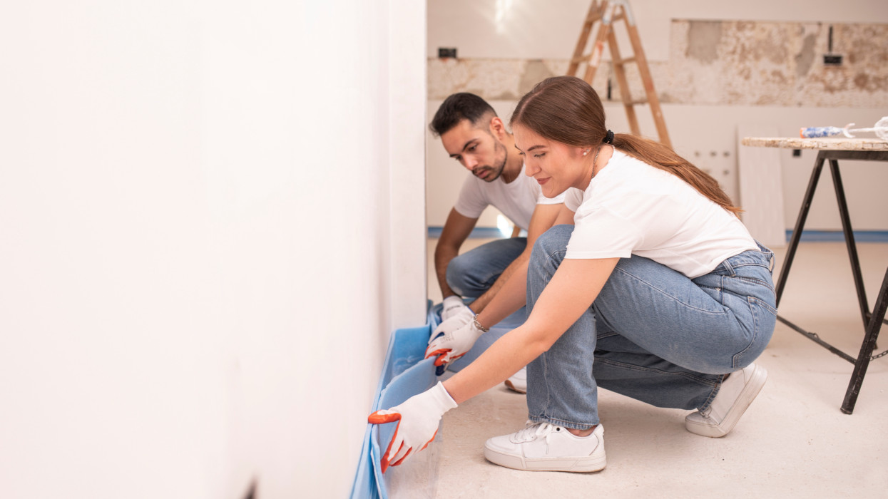 working couple in home improvement copy space image