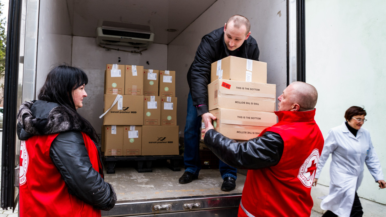 Uzhhorod, Ukraine - March 16, 2017: Employees of the Red Cross Society unload boxes of measles vaccines that entered the Transcarpathian region within the framework of humanitarian aid from Hungary.