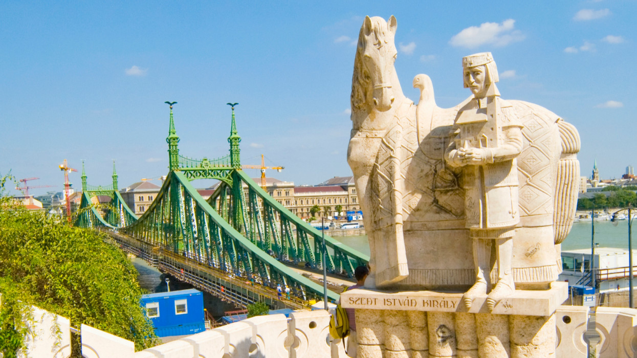 View from Gellert Hegy of Liberty (Szabadsag) Bridge in Budapest, with a statue of Saint Stephen (Szent Istvan) in the foreground.