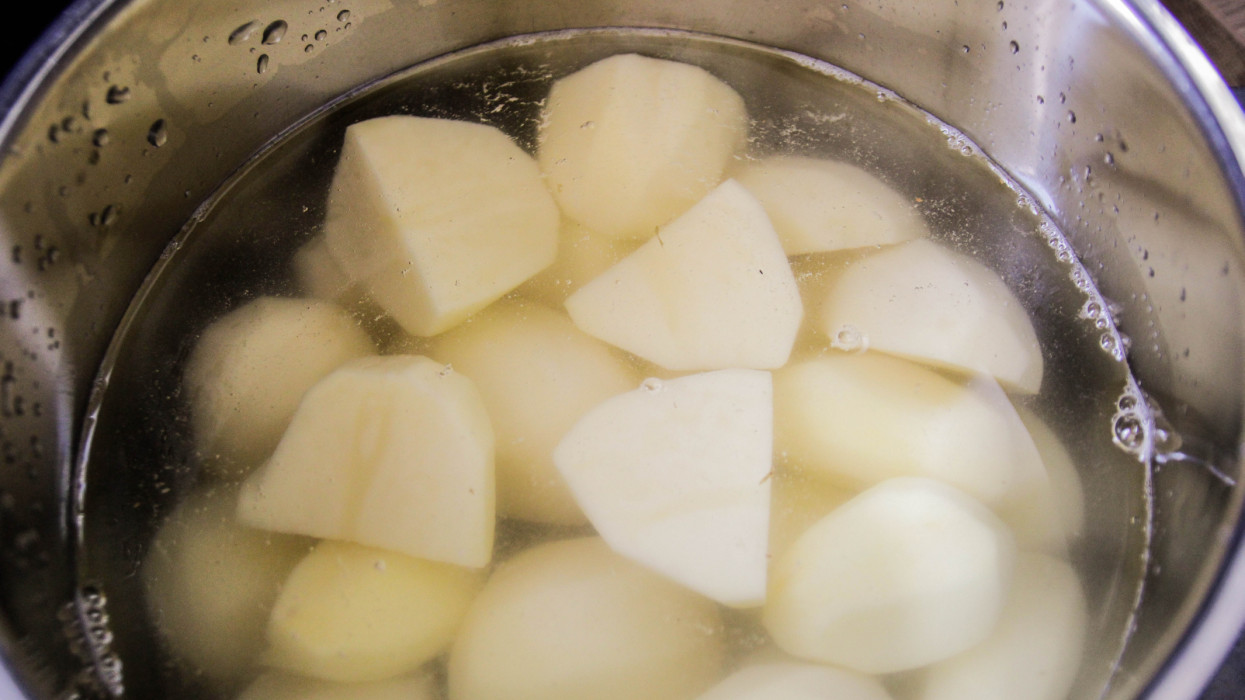 Boiling potatoes, in a pot, water