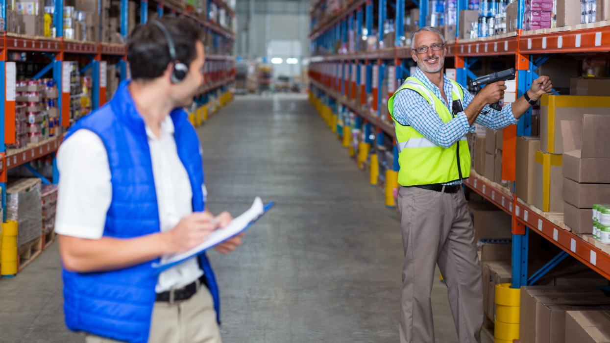 Warehouse worker interacting with each other in warehouse
