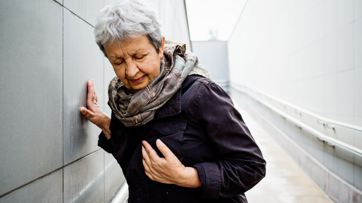 Senior woman having heart attack