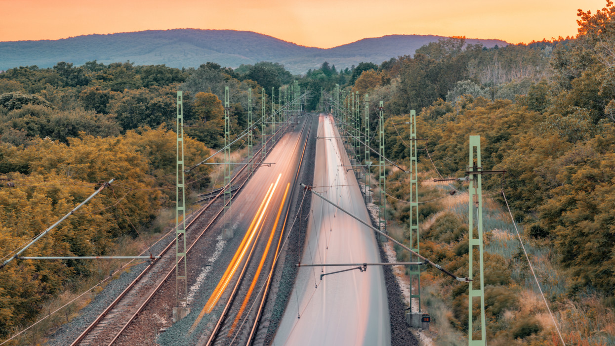 High speed trains in motion in different direction at sunset, Europe, Hungary