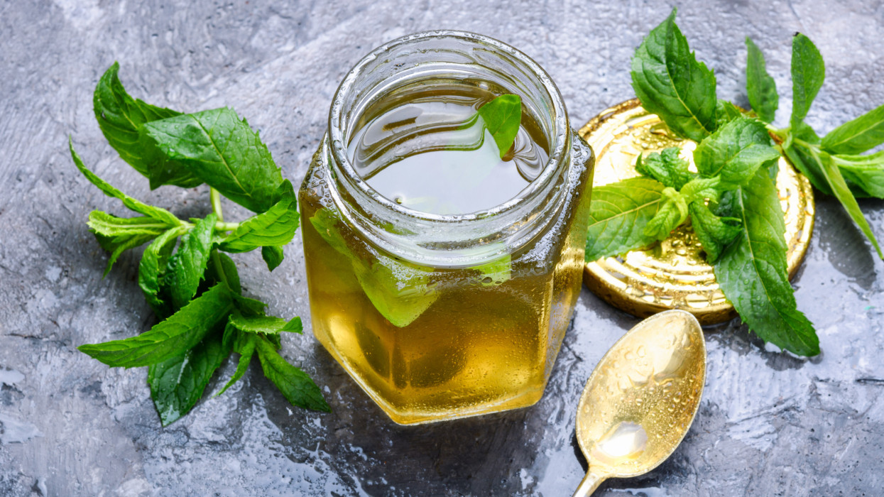 Aromatic curative jam from fresh mint leaves.Peppermint jelly.Green herbal tea