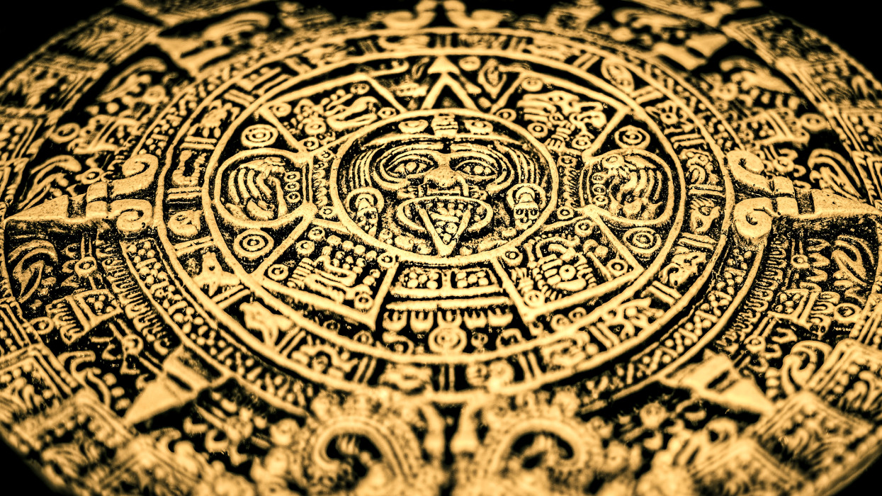An Aztec or Incan or Mayan gold coin featuring Mayan calendar treasure