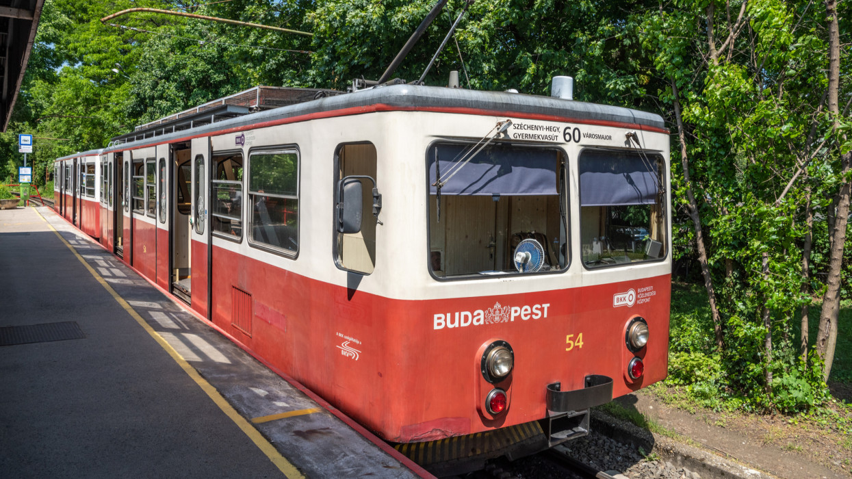 Budapest, Hungary  May 21, 2023. Railcar of Cog-wheel Railway line No. 60 in Budapest, Hungary. The Budapest Cog-wheel Railway, is a rack railway in the Buda part of the Hungarian capital city of Budapest. It connects a lower terminus at Varosmajor with an upper terminus at Szechenyihegy. The line is integrated into the citys public transport system as tram line number 60, is 3.7 kilometres in length, and was opened in 1874.