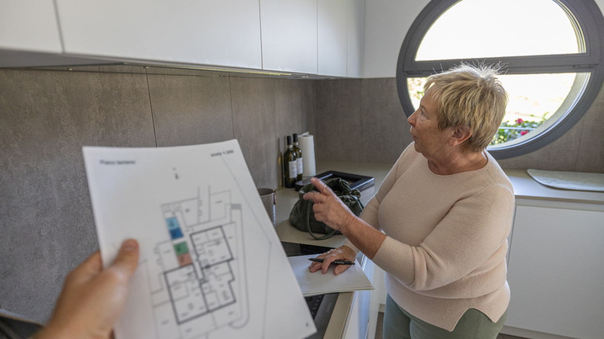 Real estate agent checking contract senior home new home