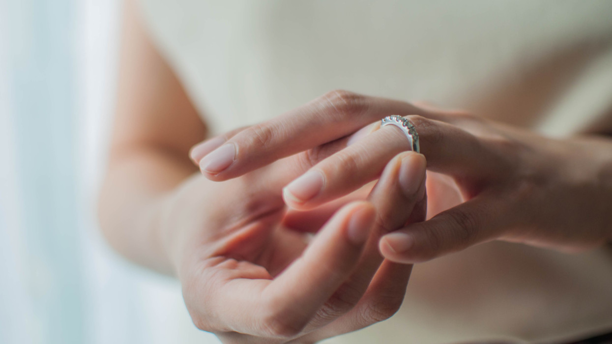 A close-up view of a young woman wearing her wedding ring