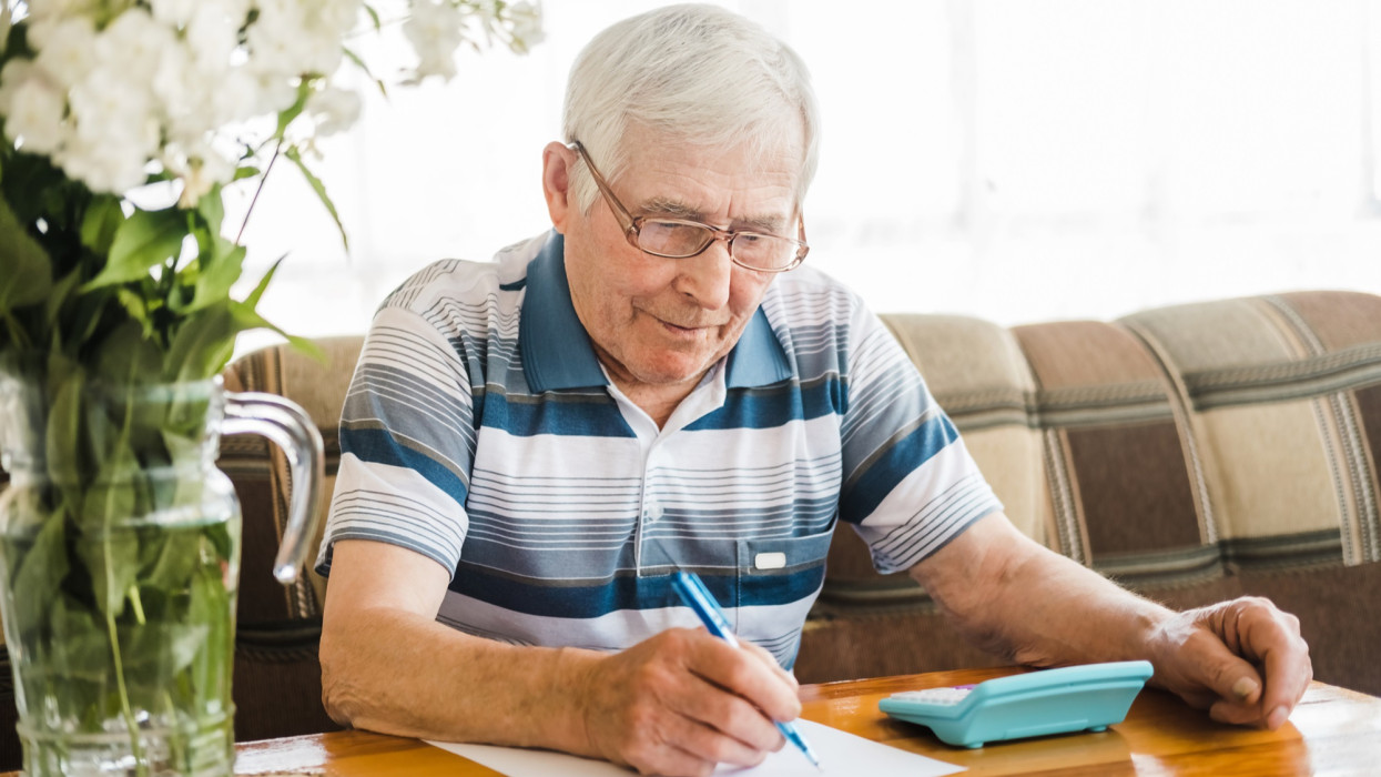 Senior Man Checking Calculating Personal Finance at Home, Feeling Stress from Money Problem. Concerned Elderly Male get Official Bank Notification, Financial Bill, Unpaid Debt or Tax and Feel Worried