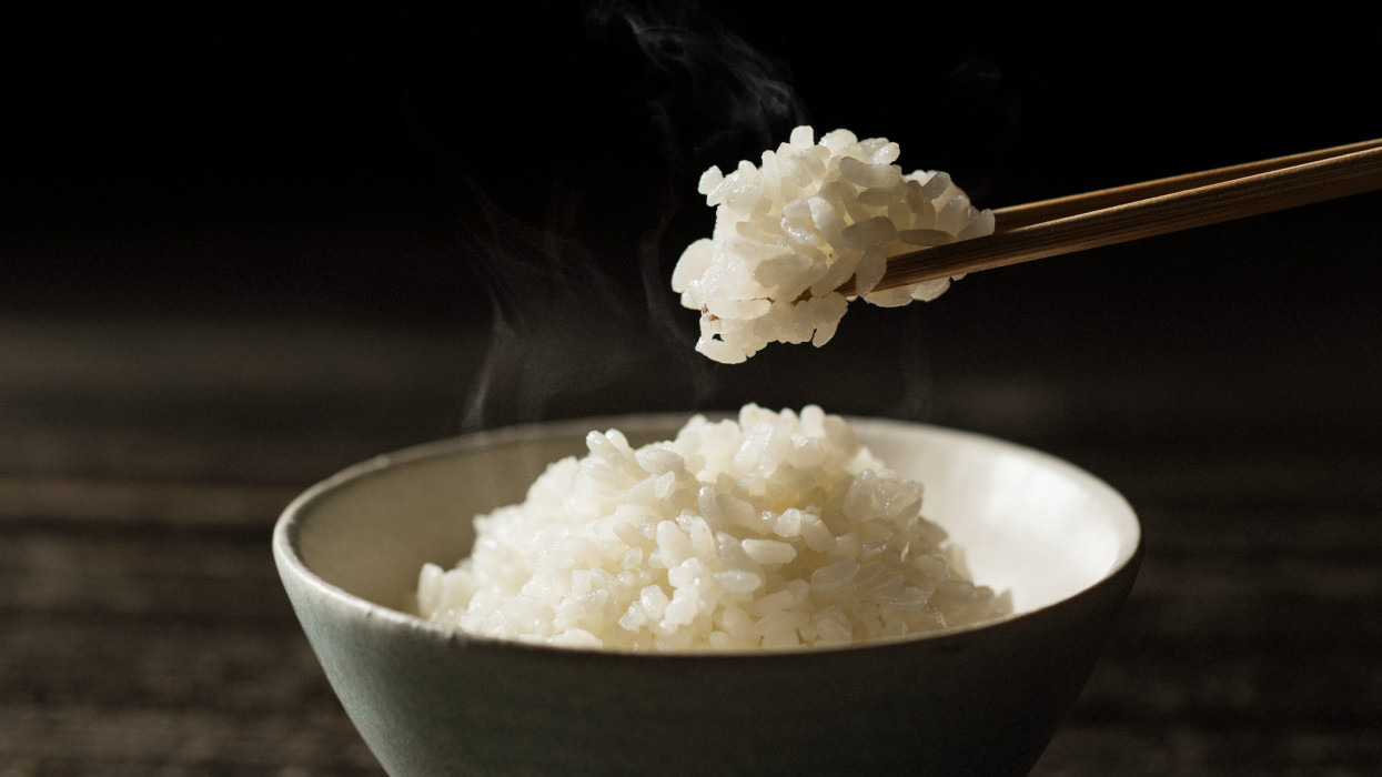 lifting the rice with chopsticks