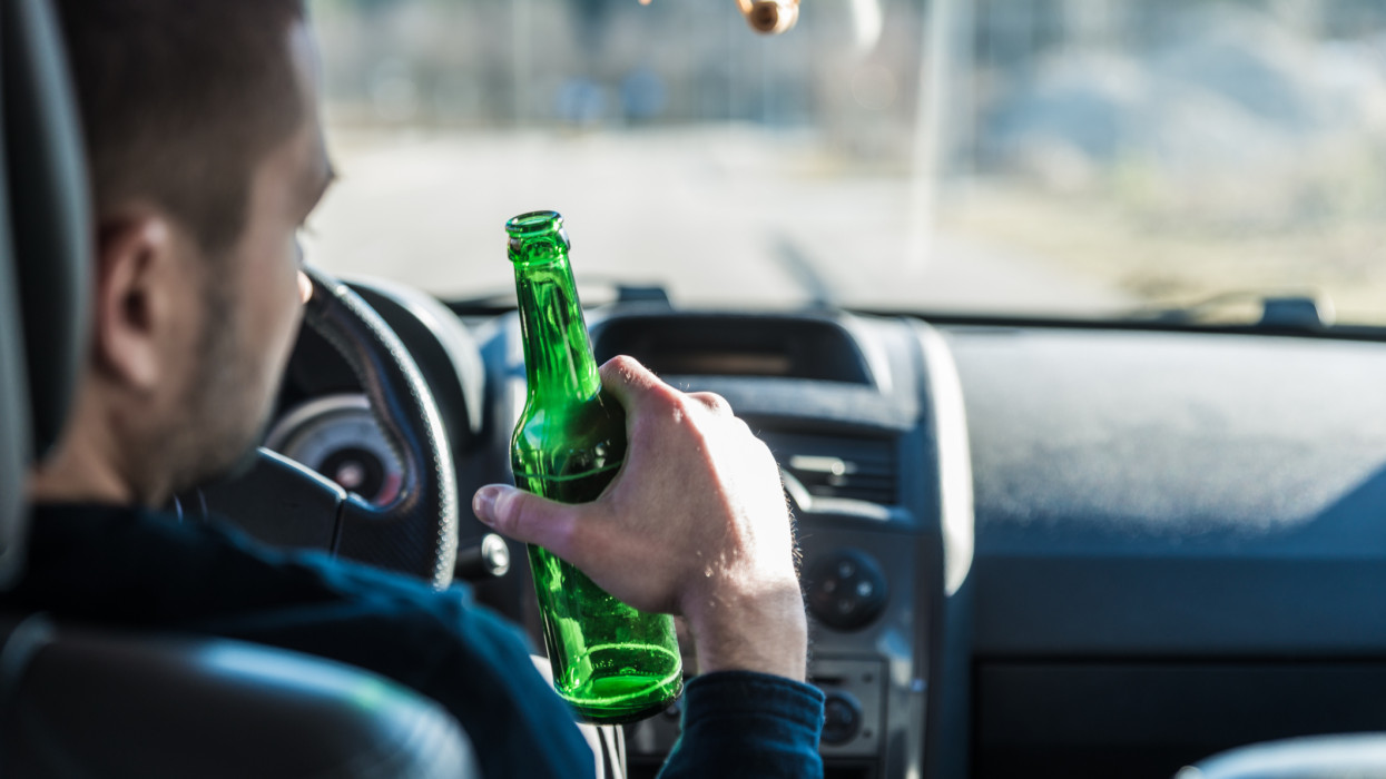 Drinking Beer while Driving a Car