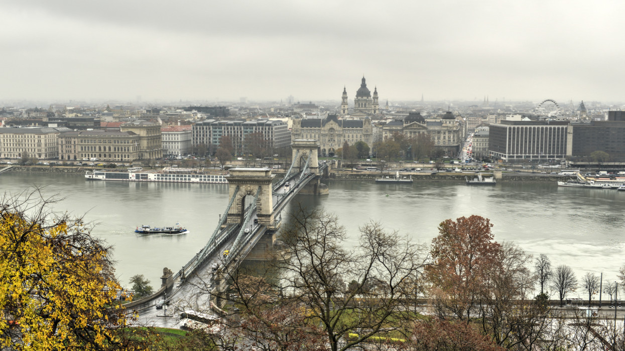 The Szechenyi Chain Bridge, a decorative suspension bridge that spans the River Danube of Budapest, the capital of Hungary as seen on a cloudy day.