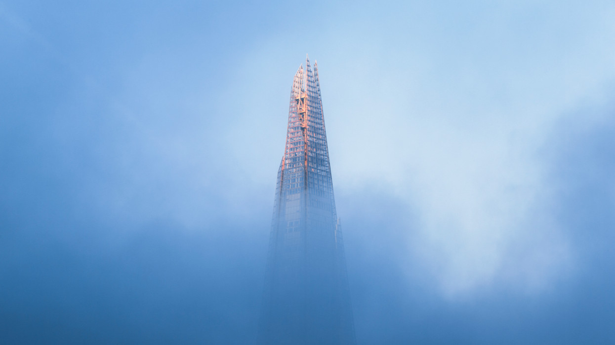 UK, London, high section of the tip of the Shard shrouded in mist