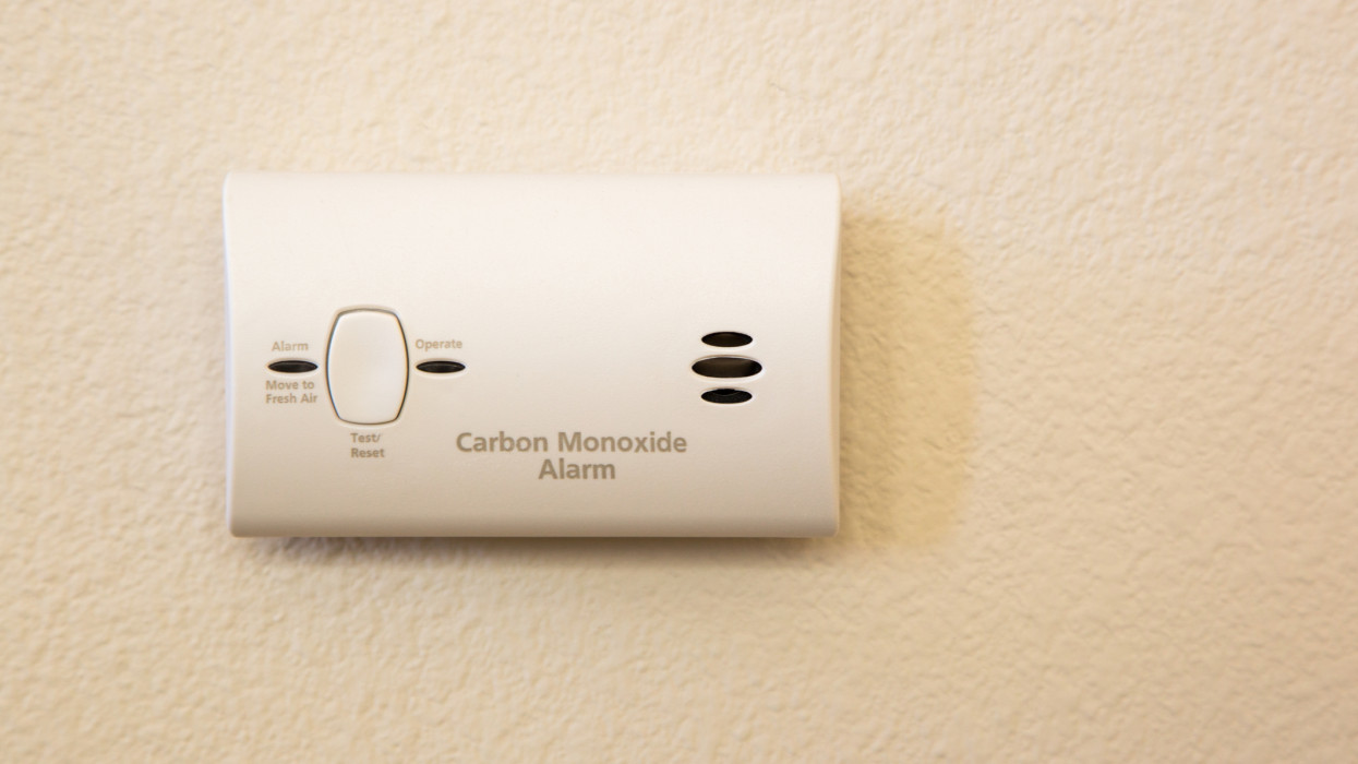 Carbon Monoxide Alarm Attached to Wall in House.