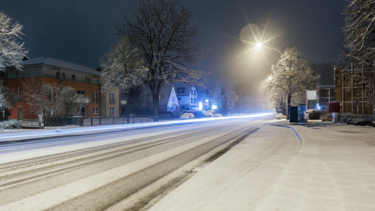 Night shot of snowfall with traffic lights