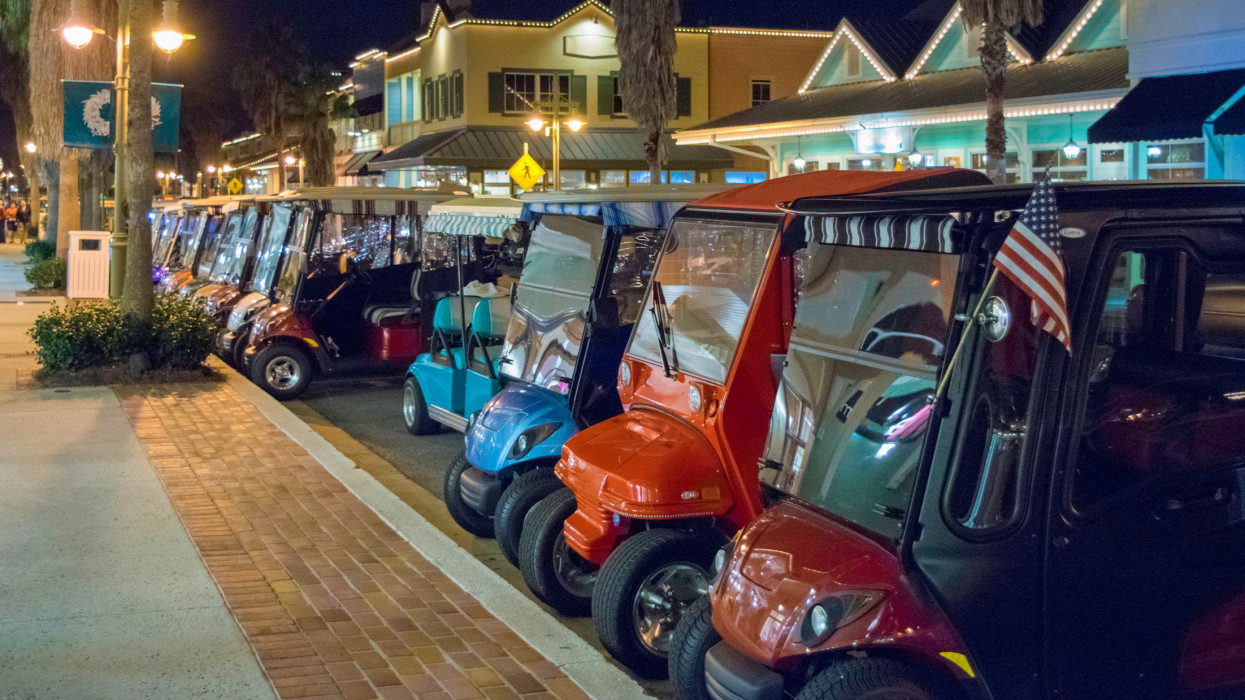Golf Carts Parked in a Row in The Villages, Florida.