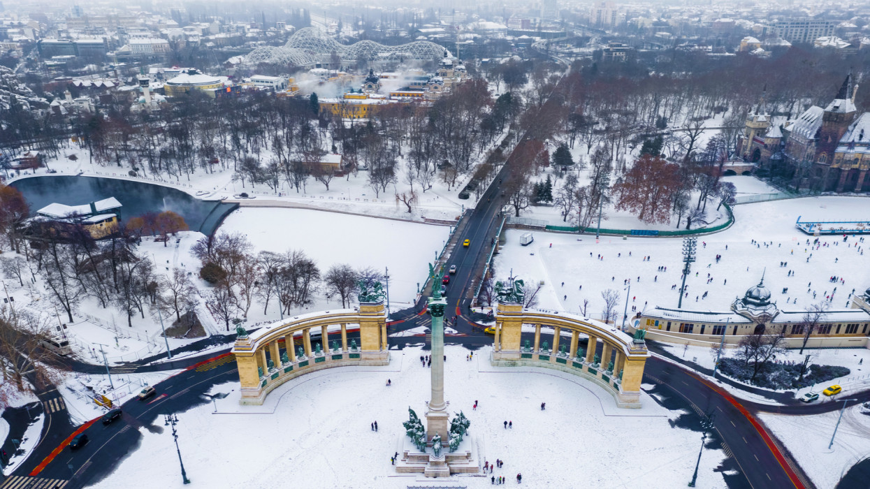 Budapest, Hungary - Snowy Heroes Square and Millennium Monument from above on a cold winter day with City Park, Szechenyi Thermal Bath and ice rink at background