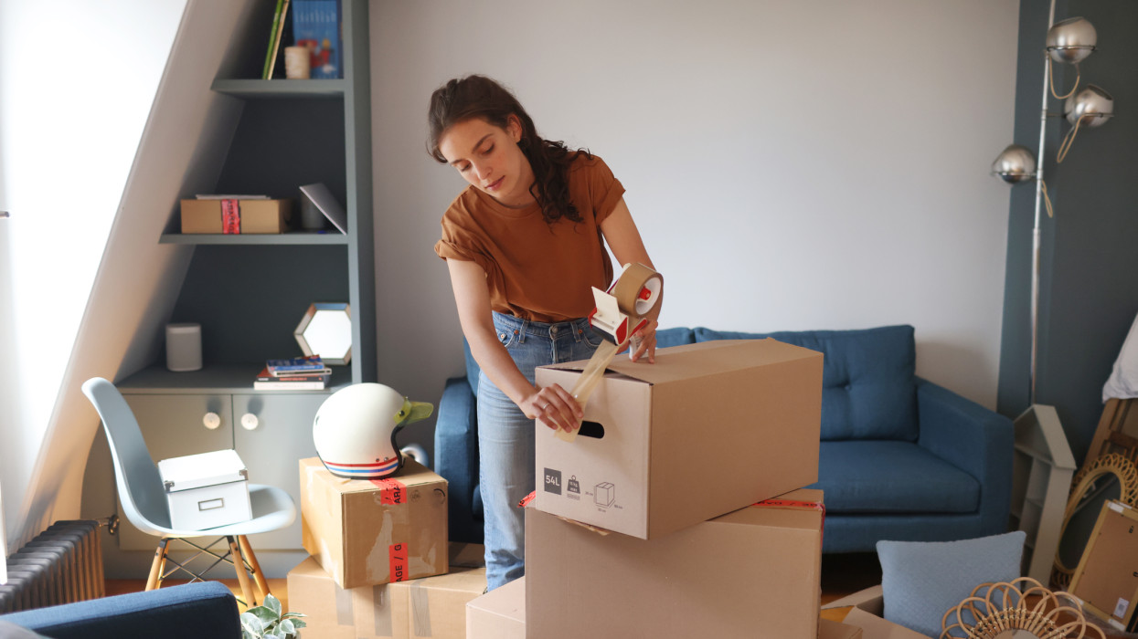 A young woman moving into a new apartment