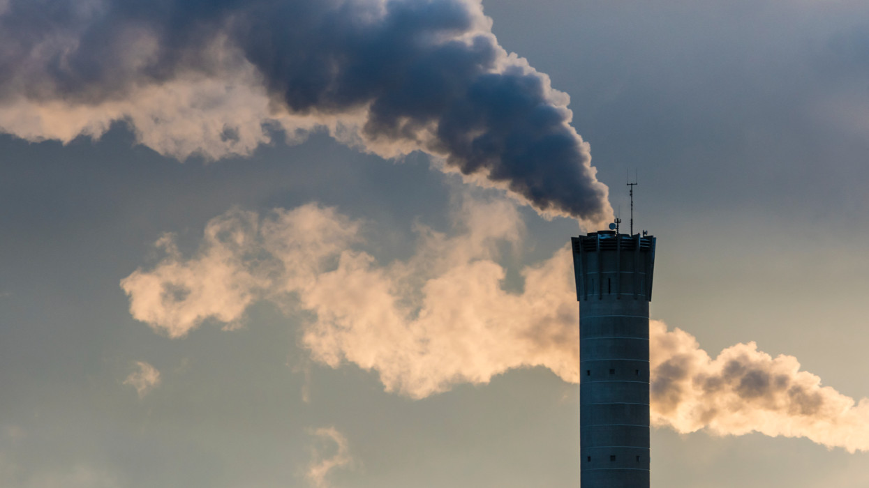 Dense smoke is leaving a smoke stack of a power plant in Zurich, Switzerland.