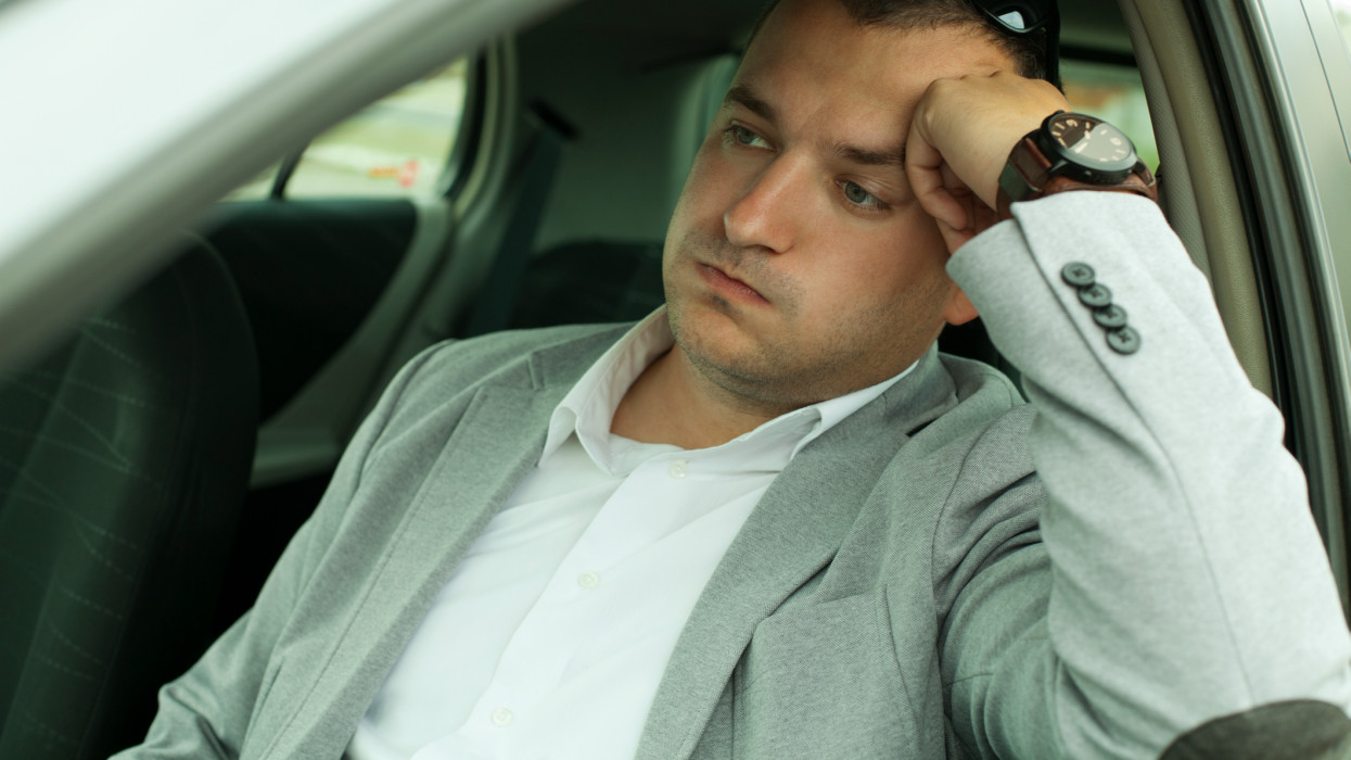businessman late for work because of traffic jams
