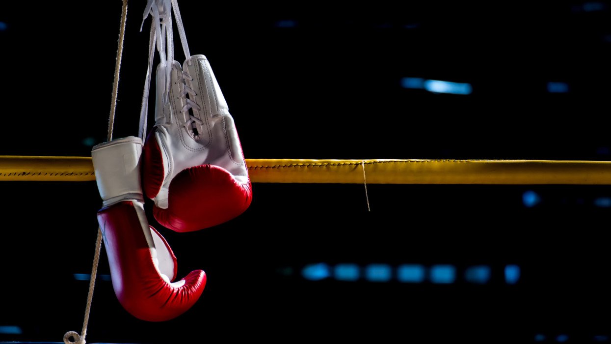 boxing gloves hangs off the boxing ring in a slum campboxing gloves hangs off the boxing ring in a slum camp