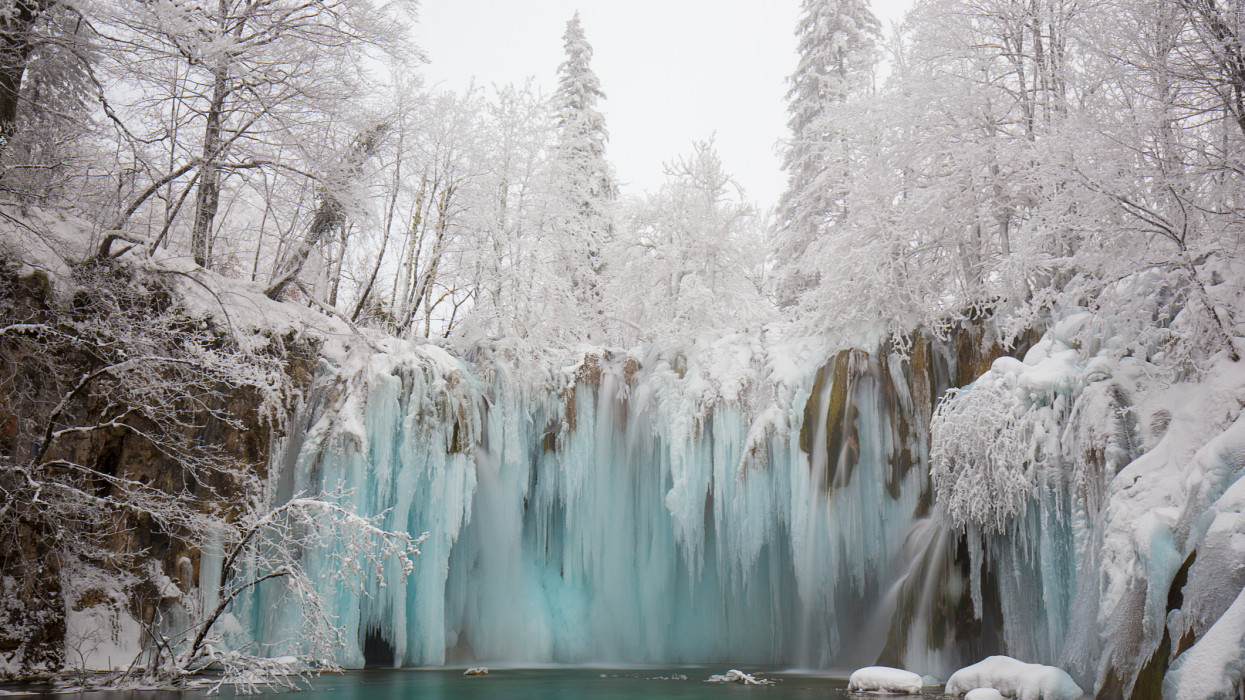 The Plitvice National Park in winter is kingdom of ice. Waterfalls are partially frozen and there are a lot of particular ice formations. The forest is completely white covered by ice.