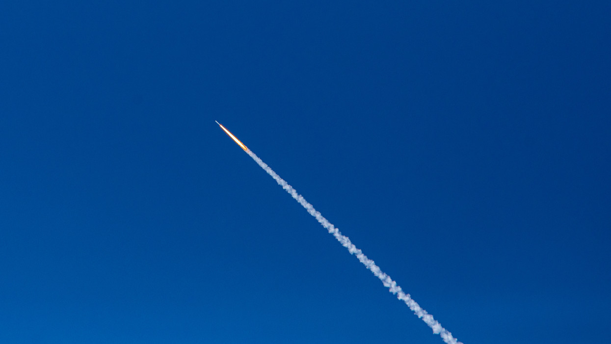 A Minotaur IV rocket lifts off from NASAs Wallops Island Flight Facility, the Mid-Atlantic Regional Spaceport, into the summer sky. Viewed from neighboring Chincoteague Island, Virginia.