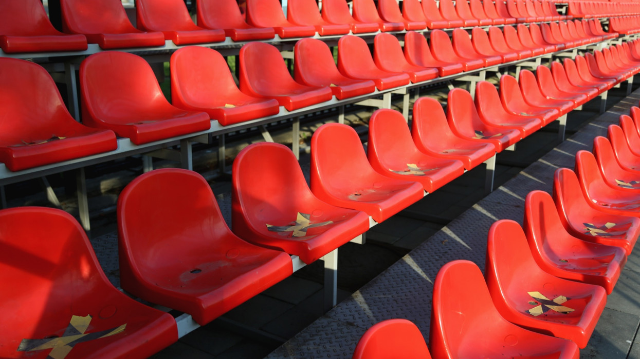 Lockdown Concept. Empty Seats With Yellow-And-Black Safety Marks On Sunny Summer Day