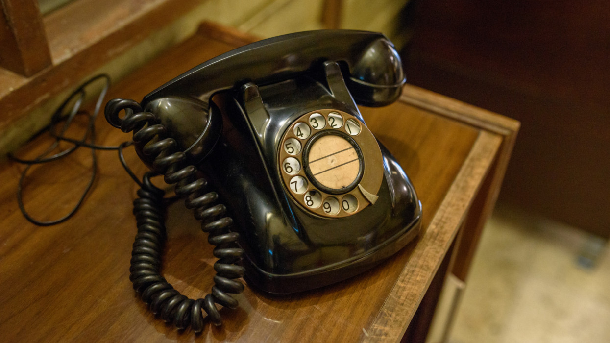Image of Vintage phone on a wooden table.