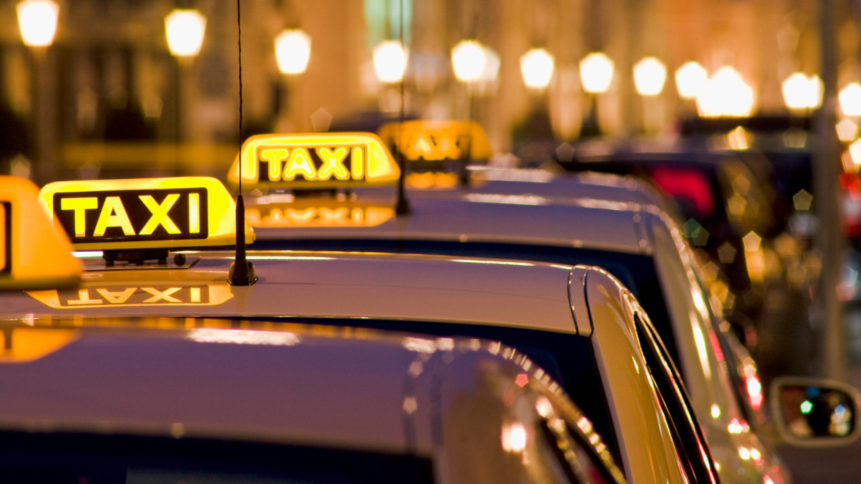 Illuminated Taxi Signs on Maximilian street, Close up, Munich, Bavaria, Germany