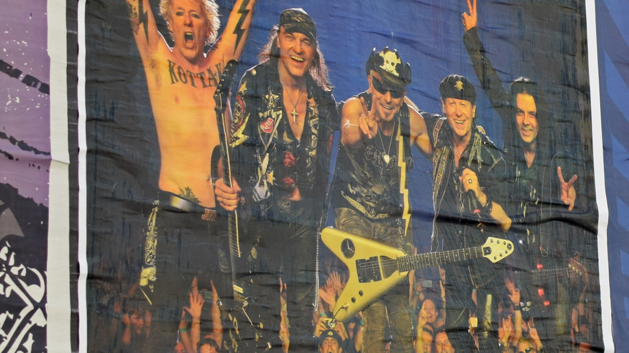 Athens, Greece - April 9, 2016: Wall with concert posters live hard rock music by the Scorpions and garage punk by the Sound Explosion and Mongrelettes.
