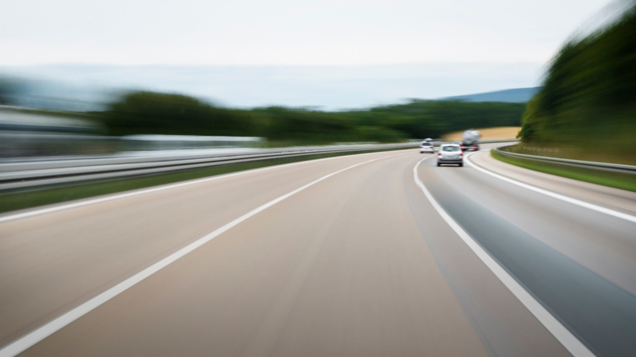 Driving on a highway - long exposure, motion blur. Unrecognisable cars