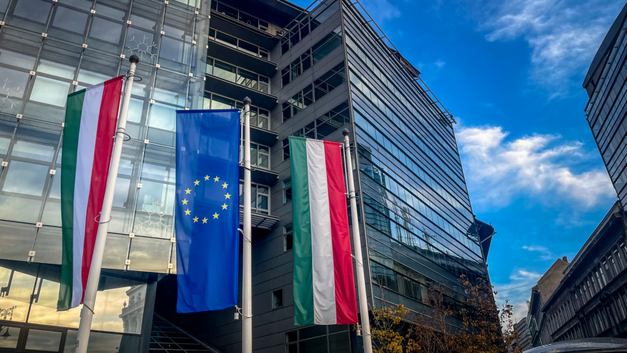 Collection of Hungarian and EU flags during a time of tension as the Hungarian government veto latest EU funding plan amid recent tensions regarding policy
