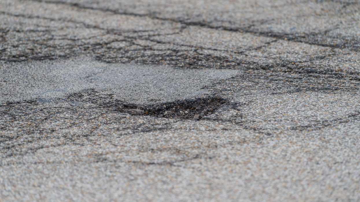 A pothole is a depression in a road surface, usually asphalt pavement, where traffic has removed broken pieces of the pavement. Potholes can cause damage to vehicle alignment and steering.