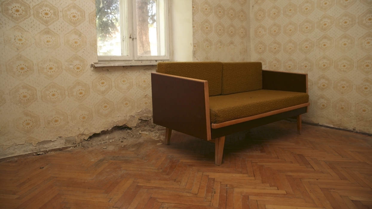 Old style sofa in  abandoned house countryside, Hungary..