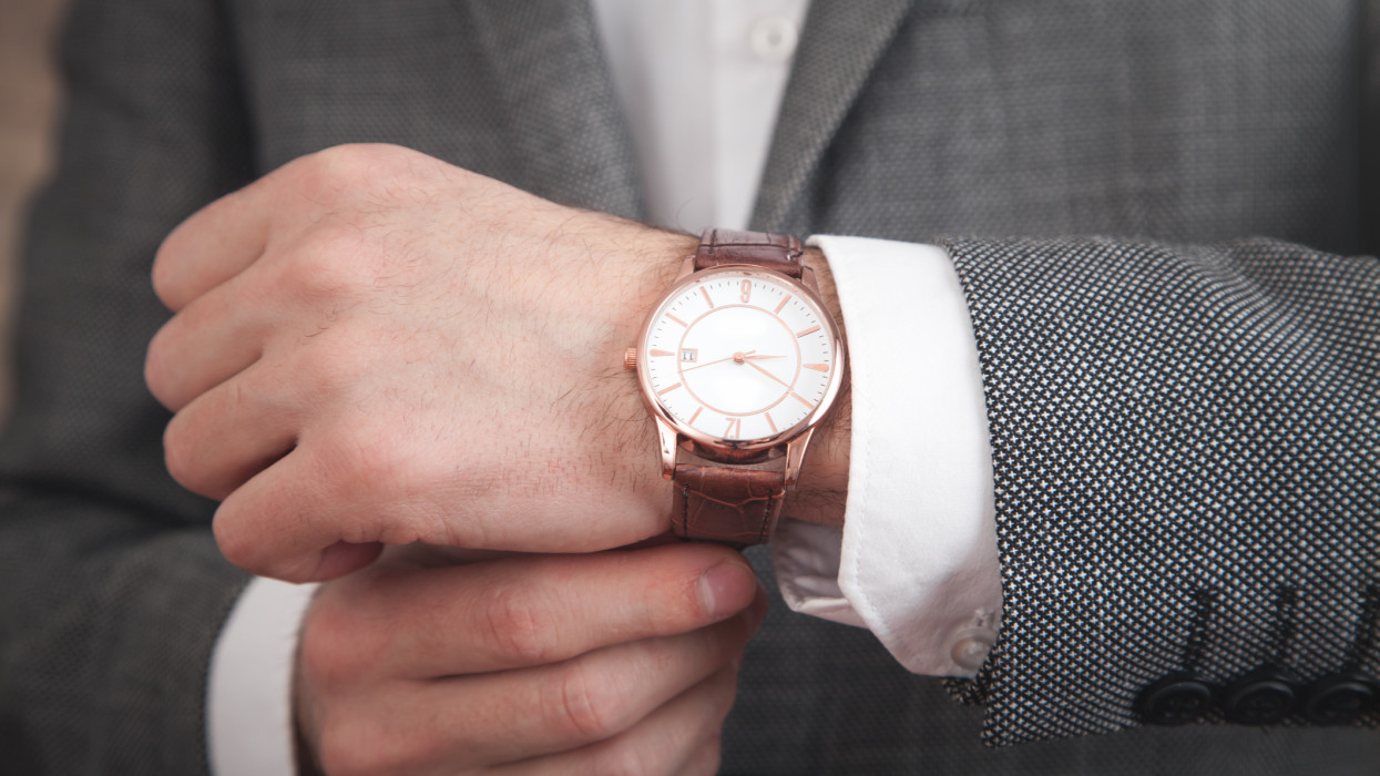 Businessman wearing luxury wristwatch. Fashion, Lifestyle