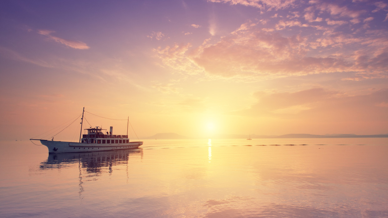 passenger ship on the lake at sunset. Location: Lake Balaton, Hungary