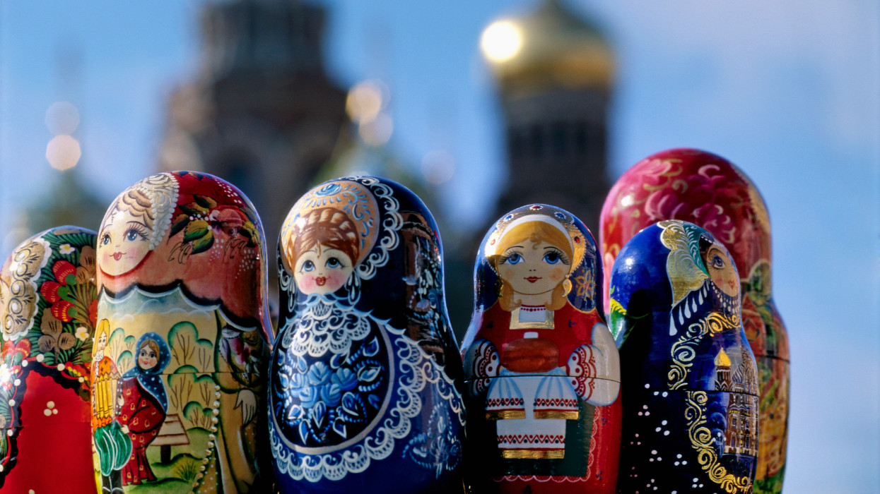 Russian nesting dolls in front of the Church of the Resurrection of Christ in St. Petersburg.