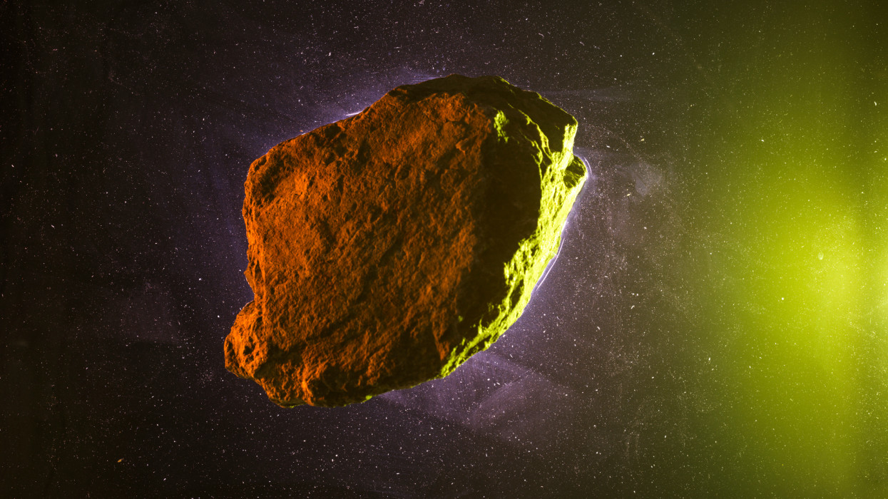 Asteroid rock on green starry background