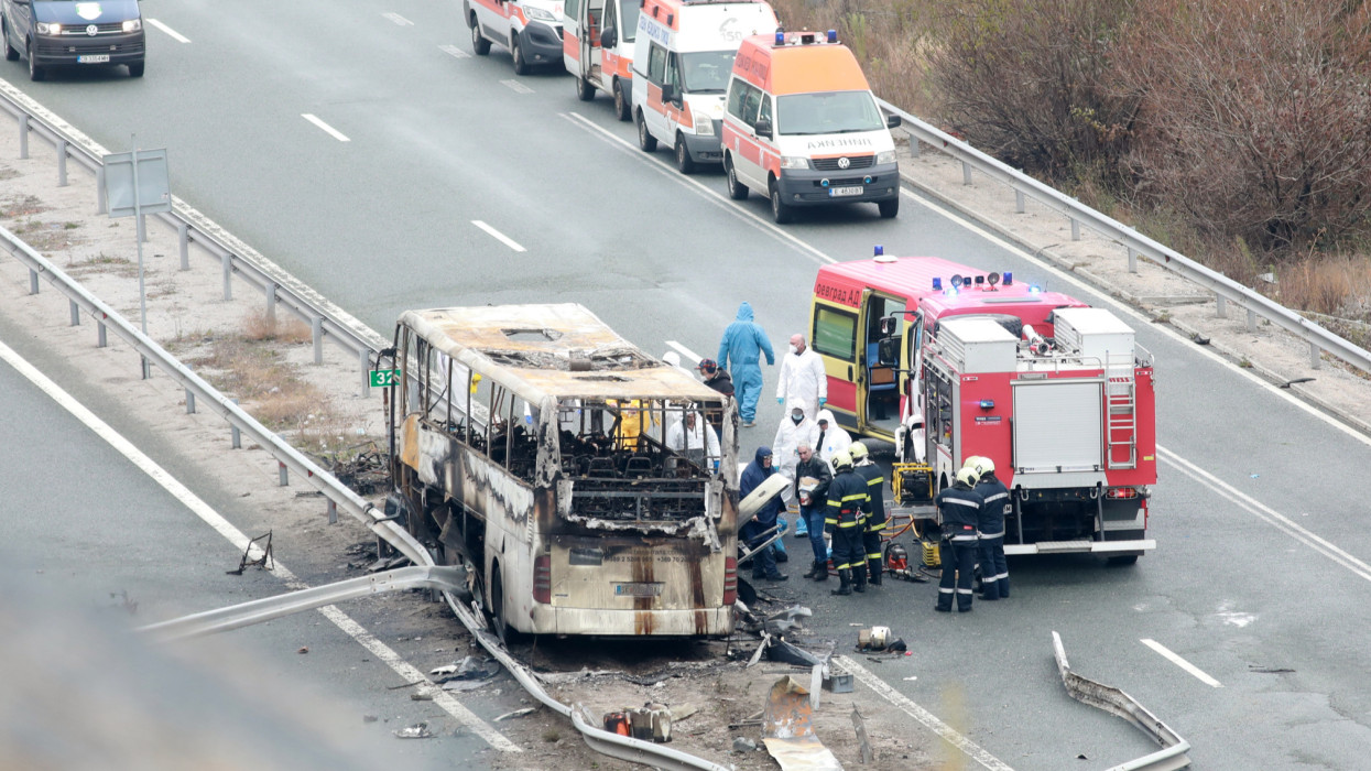Bosnek, Bulgaria - November 23, 2021: Firefighters inspect the scene of a bus crash on a highway near the village of Bosnek. A bus carrying tourists to North Macedonia crashed and caught fire in western Bulgaria early morning, killing 45 people