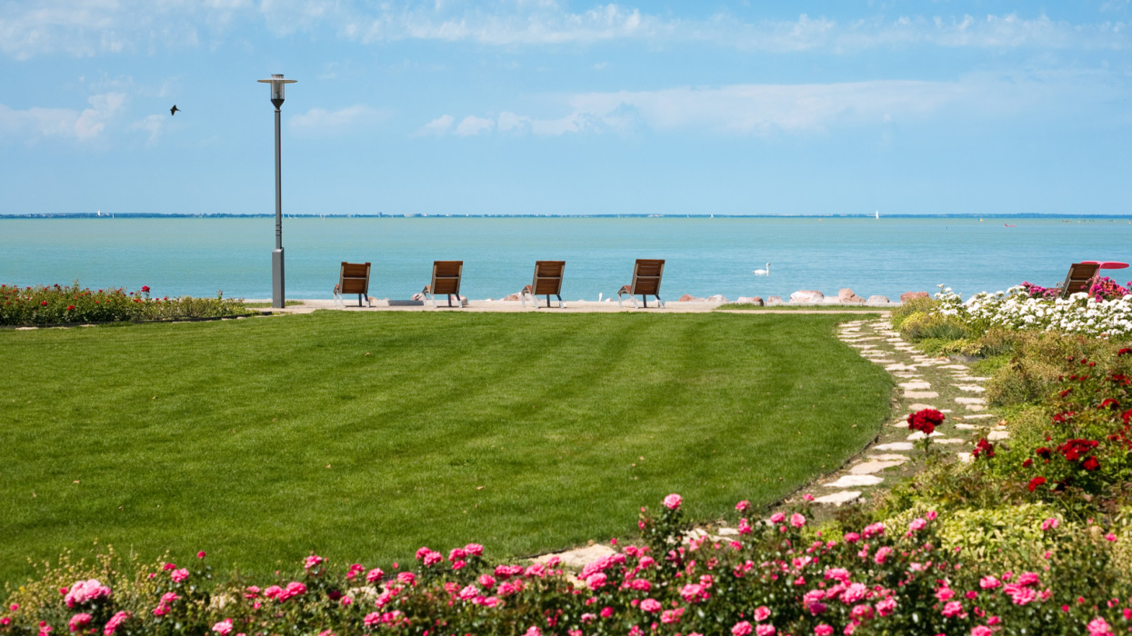 The beach of lake Balaton with a rosegarden in the front at Balatonfured, Hungary