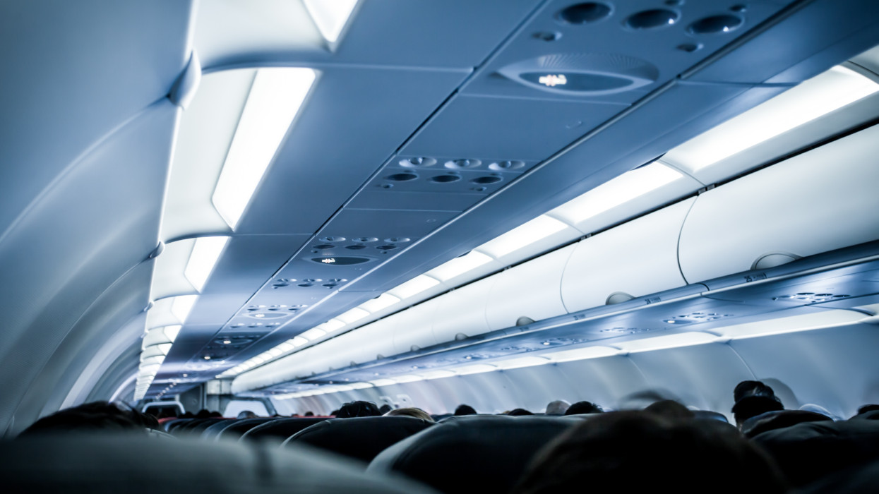 Blurred image of airplane interior in blue color filter